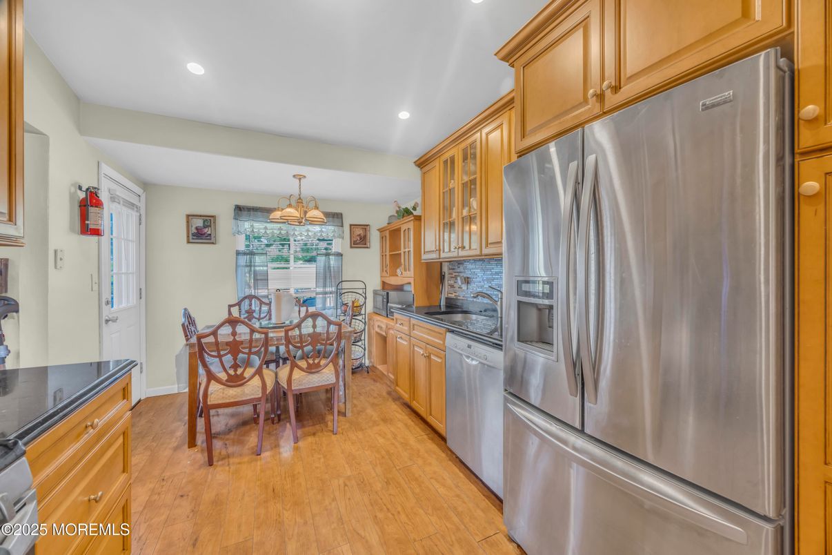 Chandelier, Dining room, Interior, Kitchen, Recessed Lighting, Stainless Steel Appliances, Wood Texture Flooring