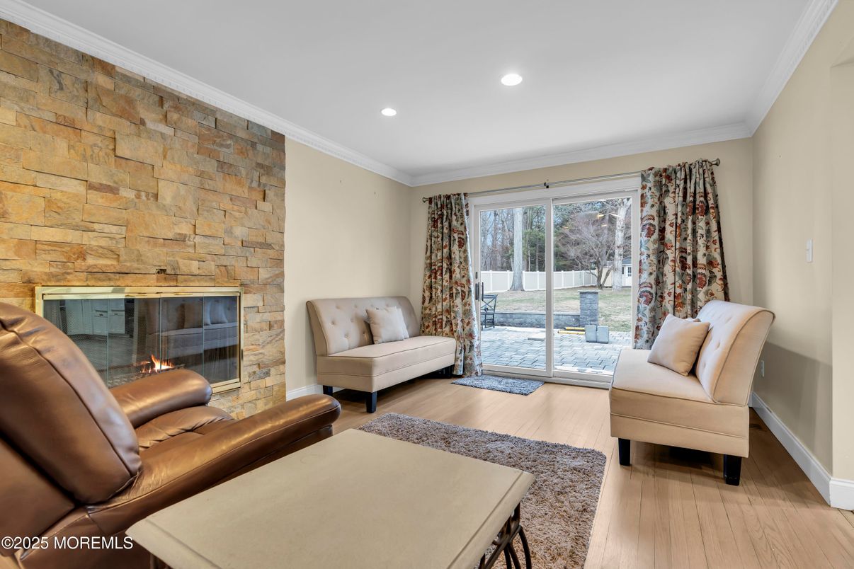 Fireplace, Interior, Living room, Recessed Lighting, Stone Walls, Wood Texture Flooring