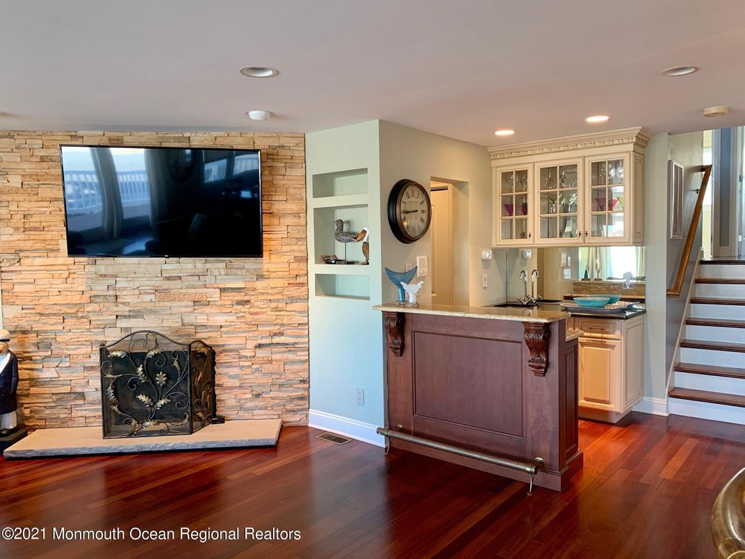 Fireplace, Interior, Kitchen, Recessed Lighting, Stone Walls, Wood Texture Flooring