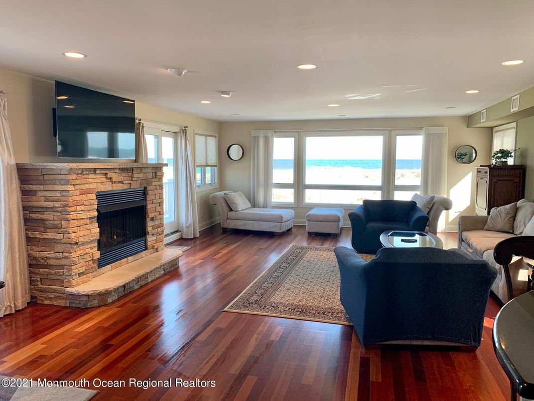 Fireplace, Interior, Living room, Recessed Lighting, Water, Wood Texture Flooring