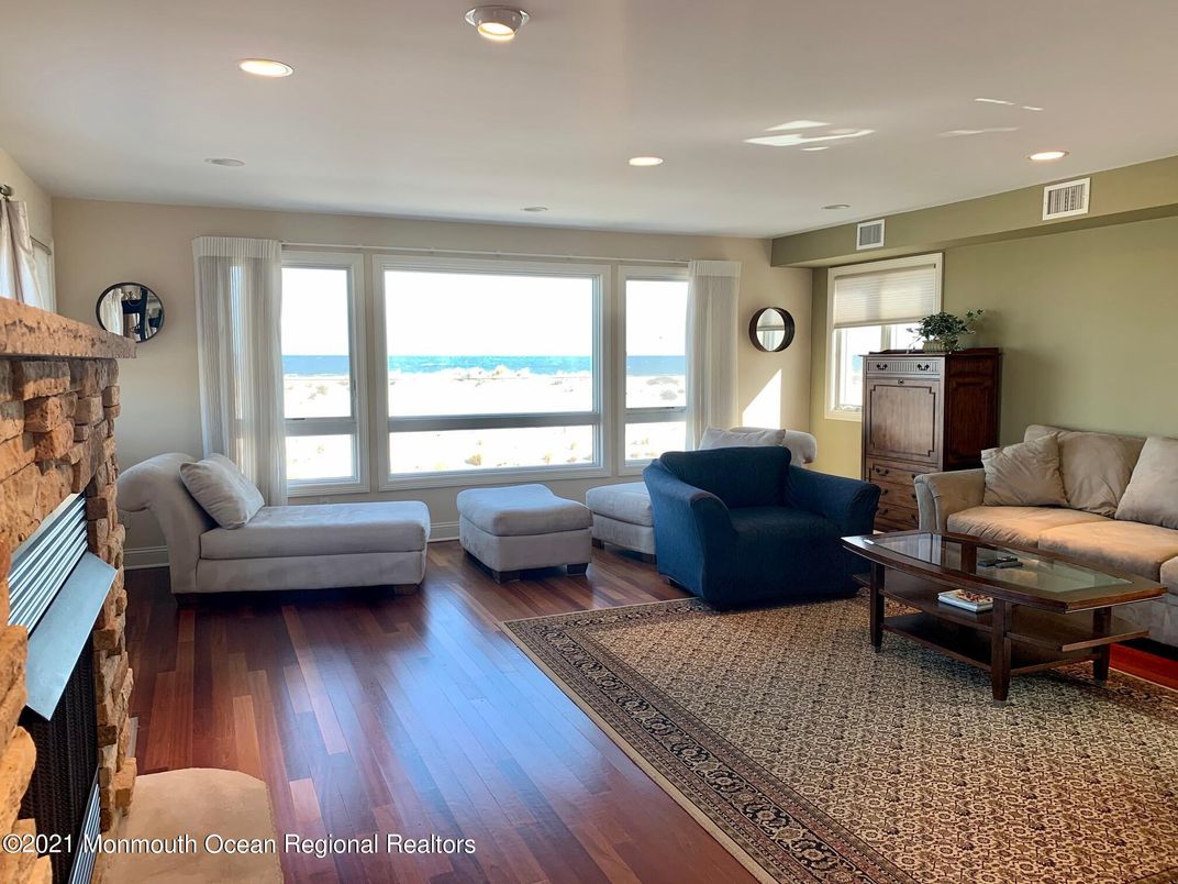 Fireplace, Interior, Living room, Recessed Lighting, Water, Wood Texture Flooring