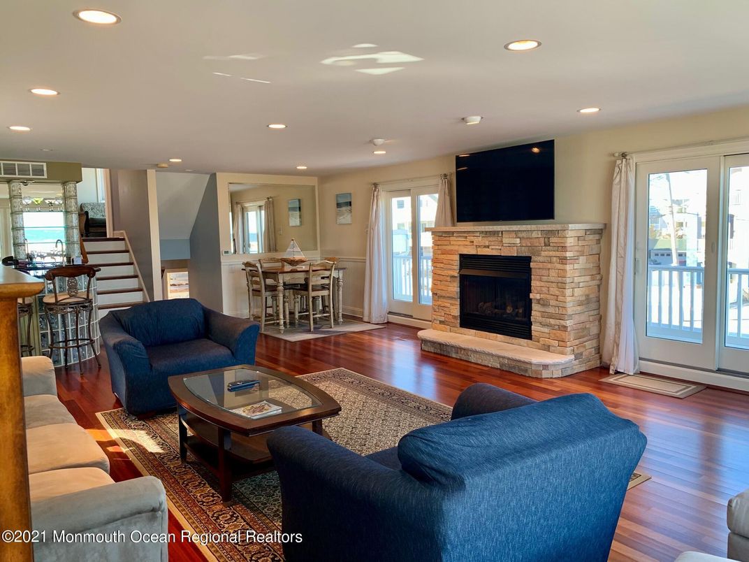 Dining room, Fireplace, Interior, Living room, Recessed Lighting, Wood Texture Flooring