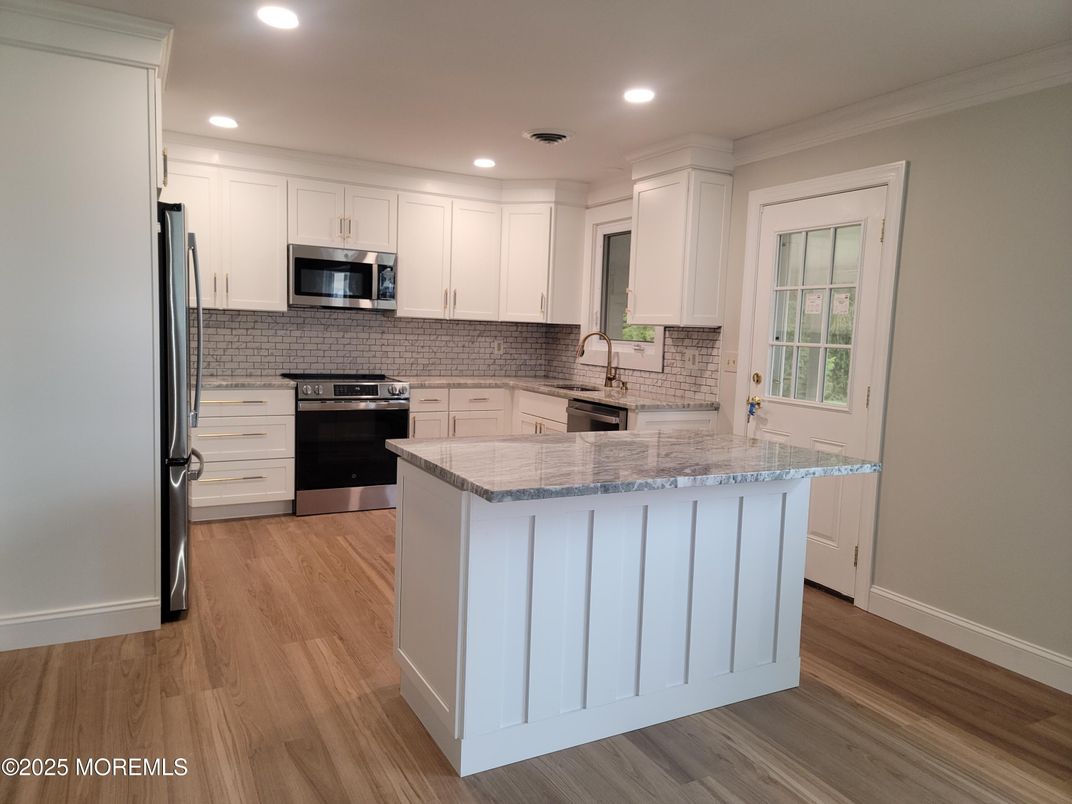 Interior, Kitchen, Recessed Lighting, Stainless Steel Appliances, Wood Texture Flooring