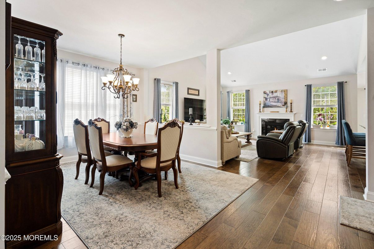 Chandelier, Dining room, Fireplace, Interior, Living room, Recessed Lighting, Wood Texture Flooring
