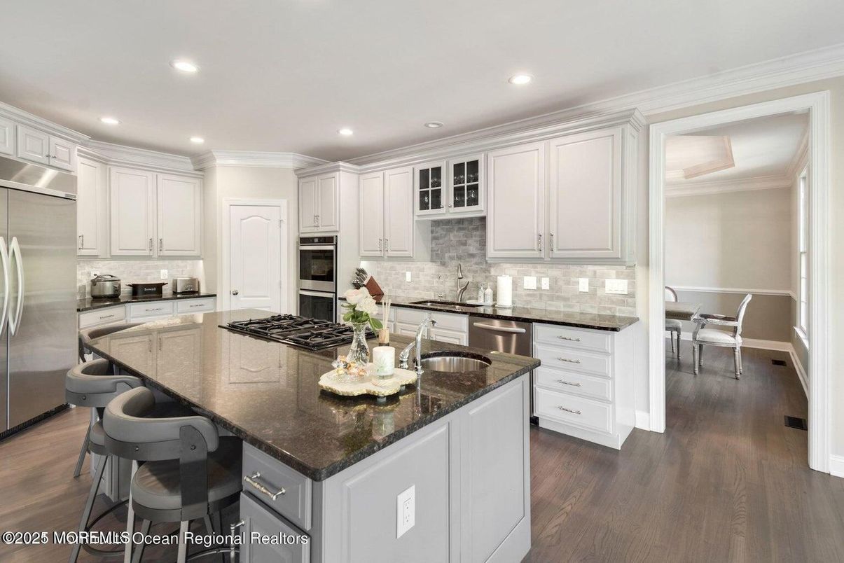 Dining room, Interior, Kitchen, Recessed Lighting, Stainless Steel Appliances, Wood Texture Flooring