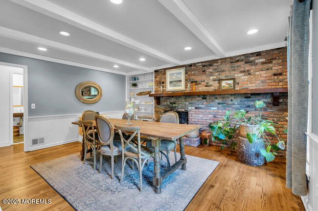 Dining room, Fireplace, Interior, Recessed Lighting, Stone Walls, Wood Texture Flooring