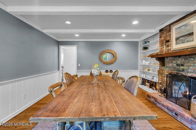 Dining room, Fireplace, Interior, Recessed Lighting, Stone Walls, Wood Texture Flooring