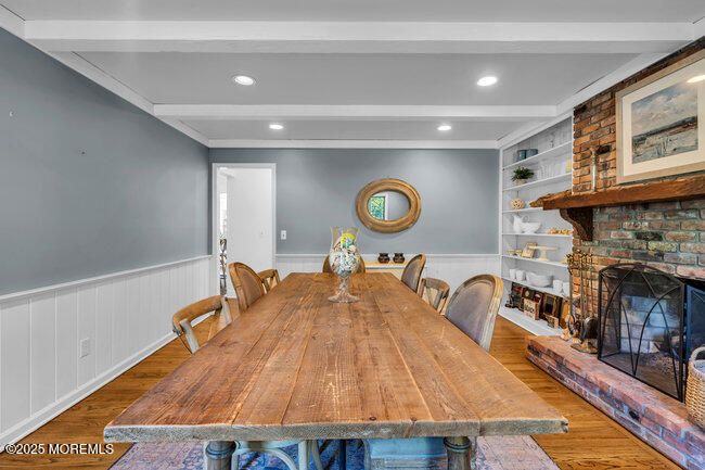 Dining room, Fireplace, Interior, Recessed Lighting, Stone Walls, Wood Texture Flooring
