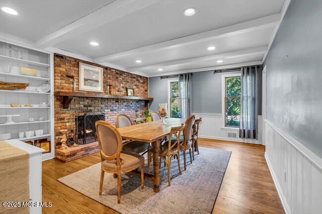 Dining room, Fireplace, Interior, Recessed Lighting, Stone Walls, Wood Texture Flooring