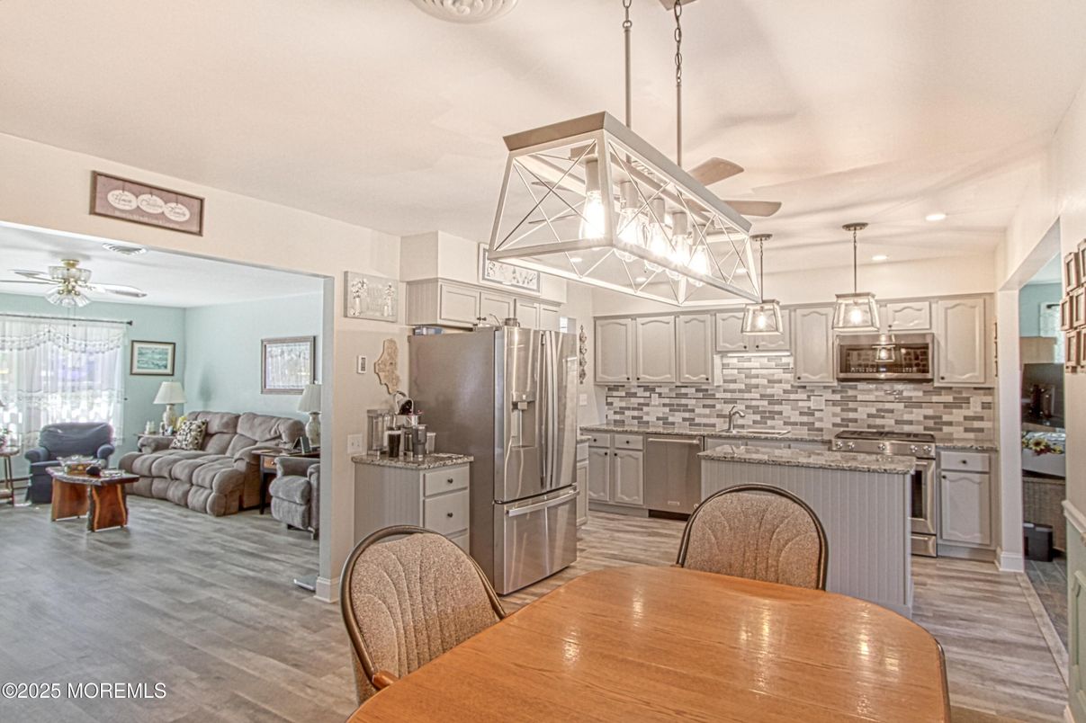 Dining room, Interior, Kitchen, Living room, Pendant Lights, Recessed Lighting, Stainless Steel Appliances, Wood Texture Flooring
