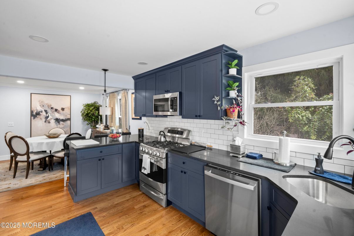 Dining room, Interior, Kitchen, Pendant Lights, Recessed Lighting, Stainless Steel Appliances, Wood Texture Flooring