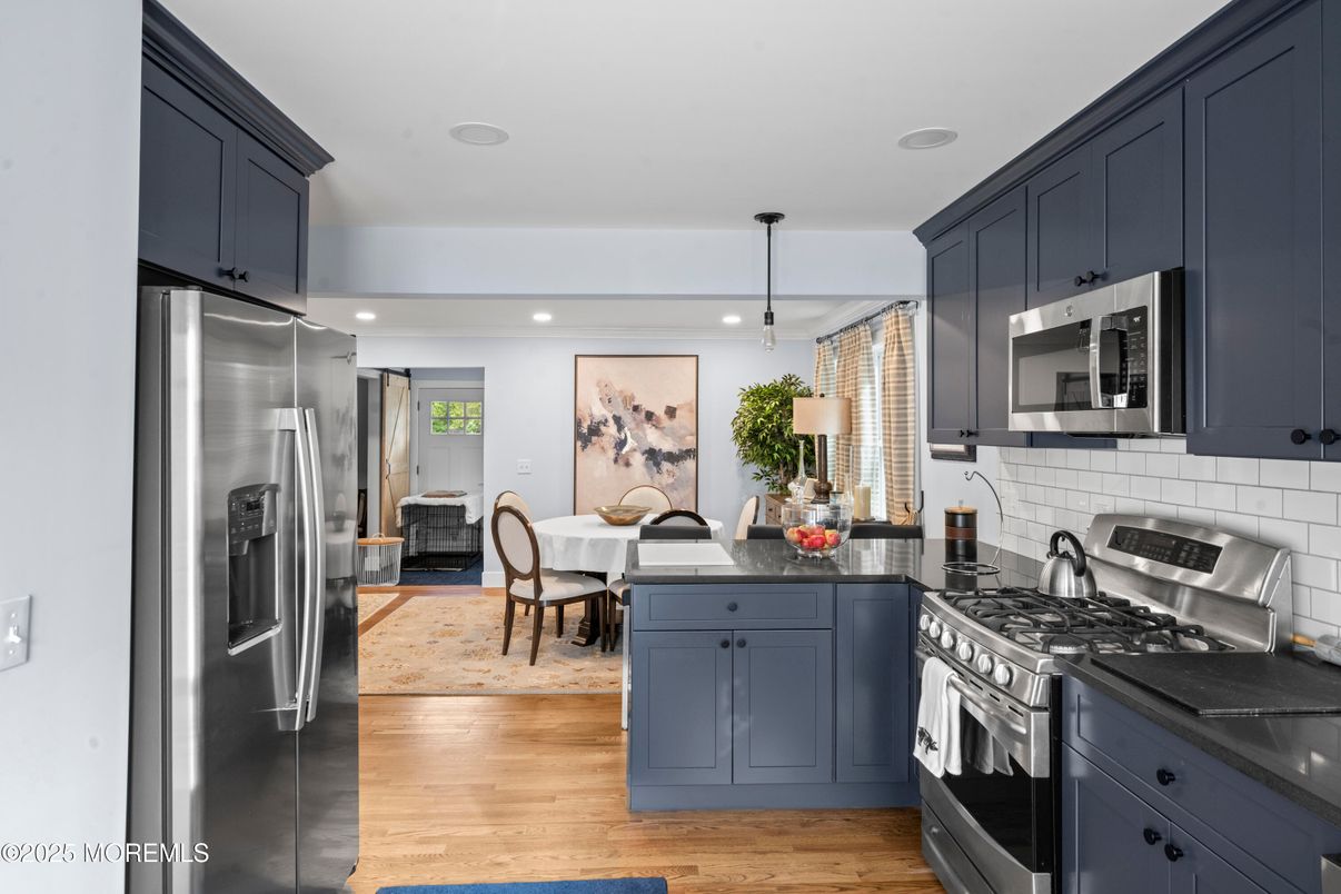 Dining room, Interior, Kitchen, Pendant Lights, Recessed Lighting, Stainless Steel Appliances, Wood Texture Flooring