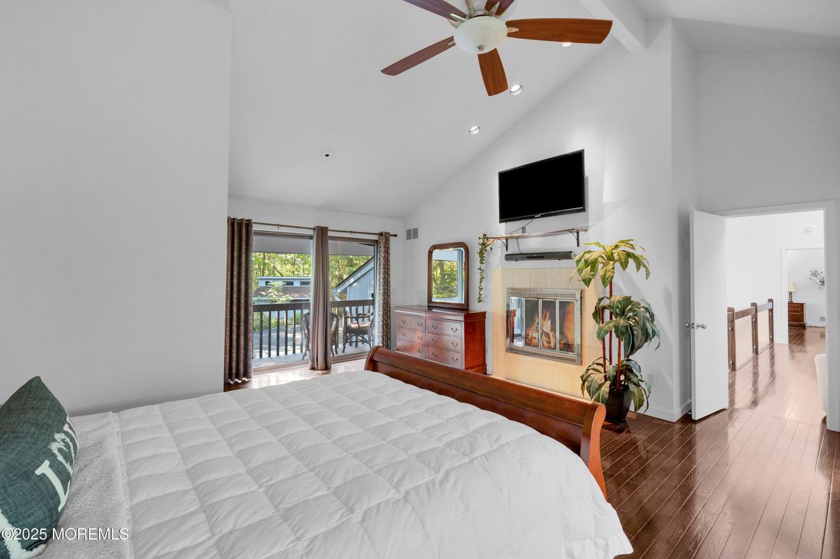Bedroom, Fireplace, Interior, Recessed Lighting, Water, Wood Texture Flooring