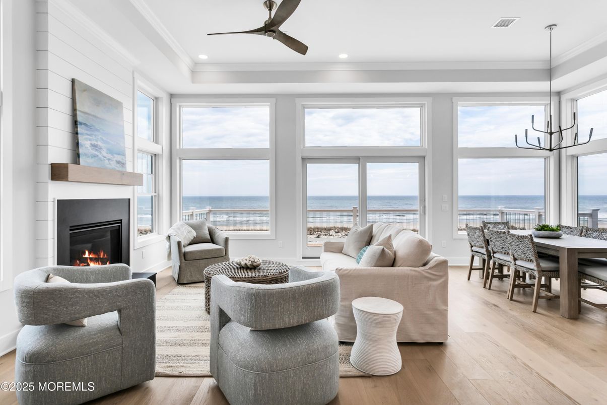 Dining room, Fireplace, Interior, Living room, Pendant Lights, Recessed Lighting, Water, Wood Texture Flooring