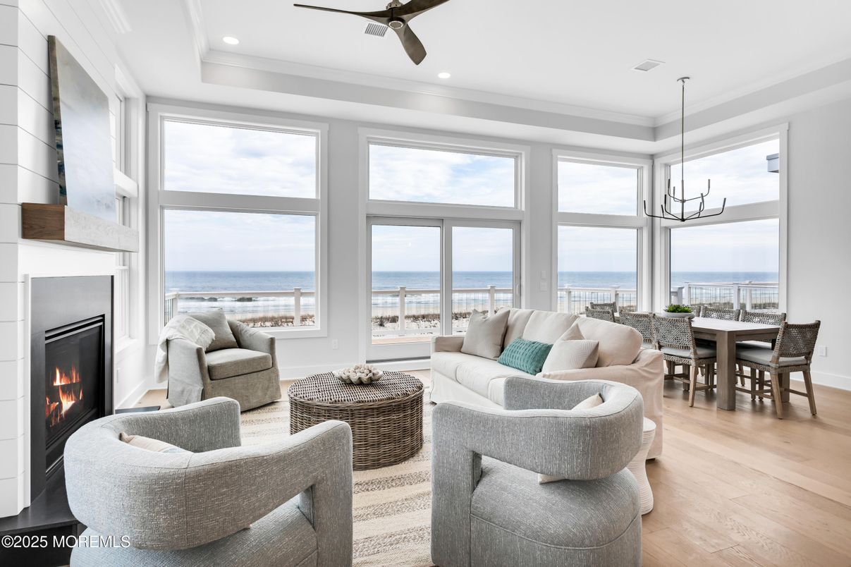 Chandelier, Dining room, Fireplace, Interior, Living room, Pendant Lights, Recessed Lighting, Water, Wood Texture Flooring