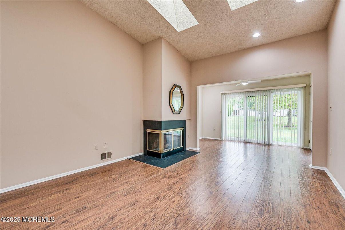 Empty room, Fireplace, Interior, Recessed Lighting, Wood Texture Flooring