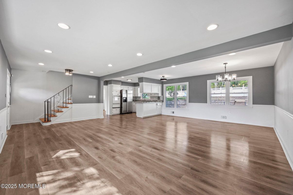 Chandelier, Empty room, Interior, Kitchen, Recessed Lighting, Stainless Steel Appliances, Wood Texture Flooring