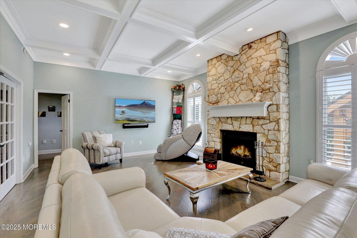 Fireplace, Interior, Living room, Recessed Lighting, Stone Walls, Wood Texture Flooring