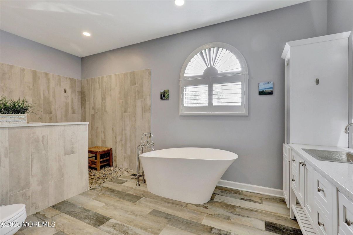 Bathroom, Free Standing Baths, Interior, Recessed Lighting, Wood Texture Flooring, Wooden Walls
