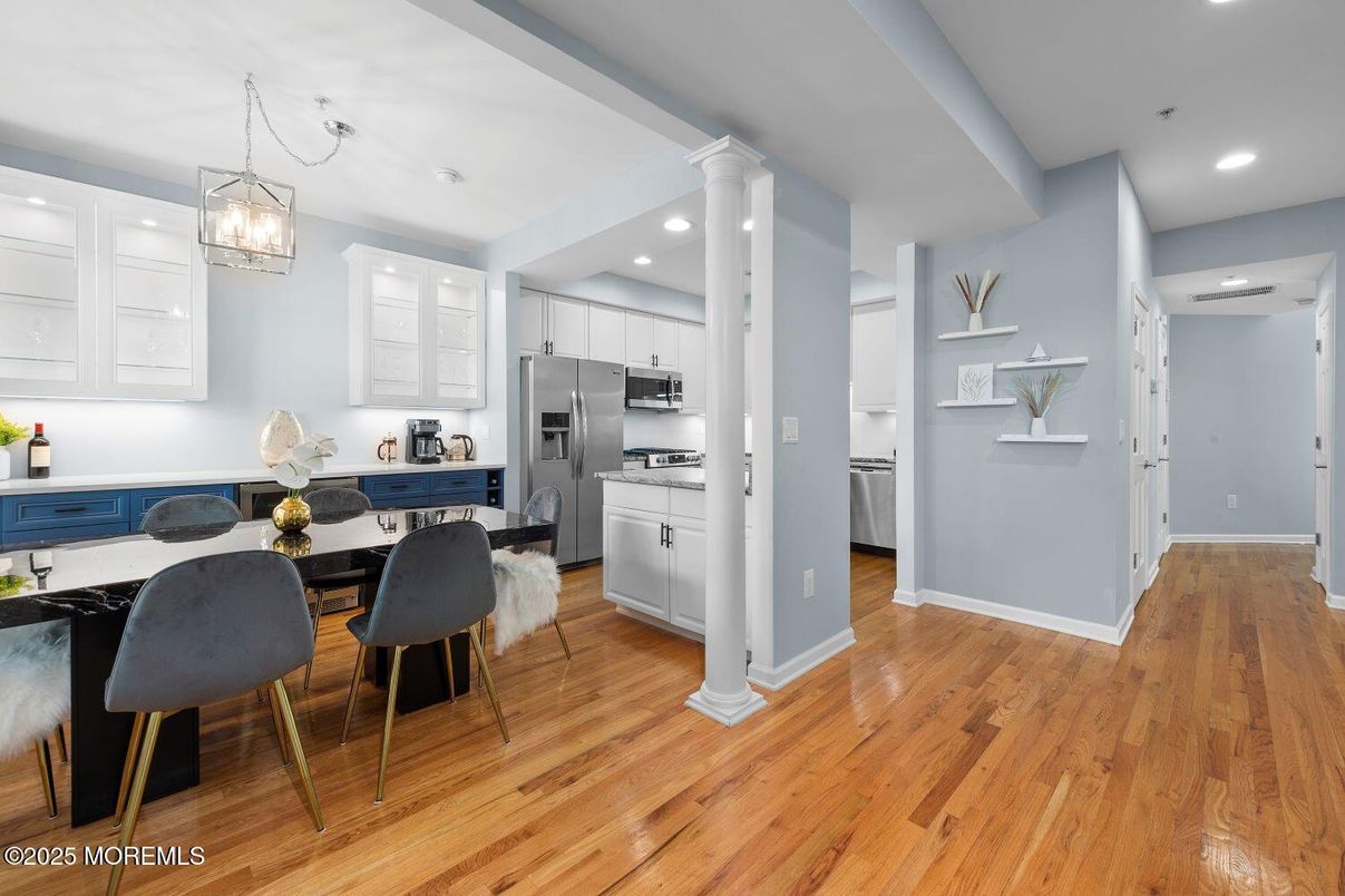 Dining room, Interior, Kitchen, Pendant Lights, Recessed Lighting, Stainless Steel Appliances, Wood Texture Flooring