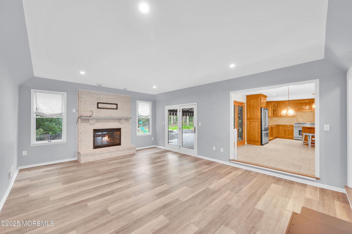 Empty room, Fireplace, Interior, Kitchen, Pendant Lights, Recessed Lighting, Wood Texture Flooring