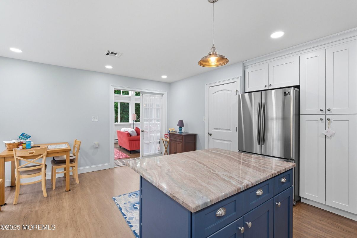 Dining room, Interior, Kitchen, Pendant Lights, Recessed Lighting, Stainless Steel Appliances, Wood Texture Flooring