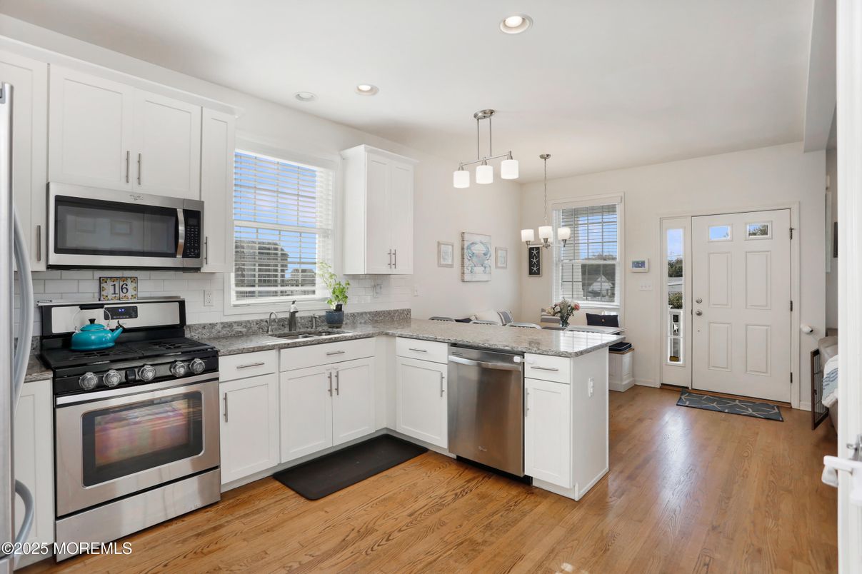 Chandelier, Interior, Kitchen, Pendant Lights, Recessed Lighting, Stainless Steel Appliances, Wood Texture Flooring