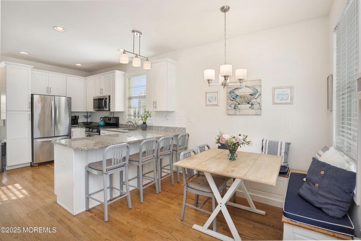 Dining room, Interior, Kitchen, Pendant Lights, Recessed Lighting, Stainless Steel Appliances, Wood Texture Flooring