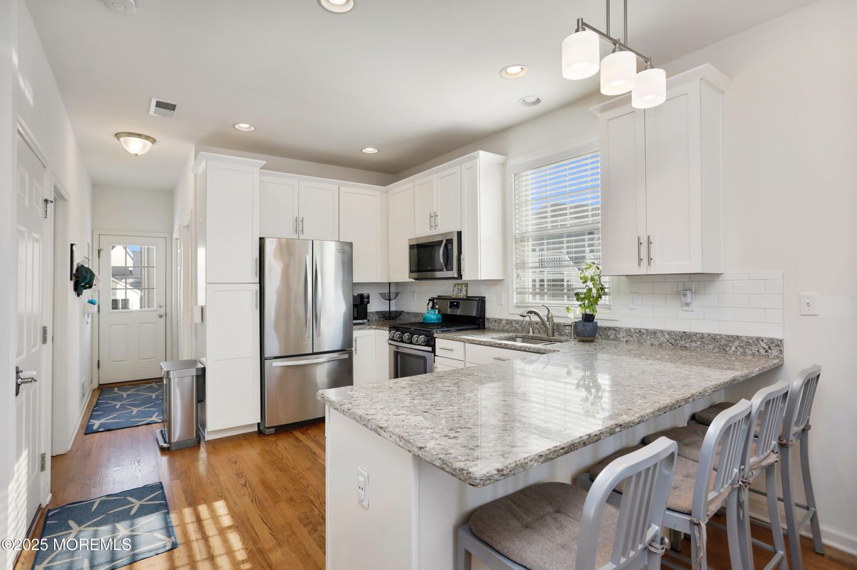 Interior, Kitchen, Pendant Lights, Recessed Lighting, Stainless Steel Appliances, Wood Texture Flooring