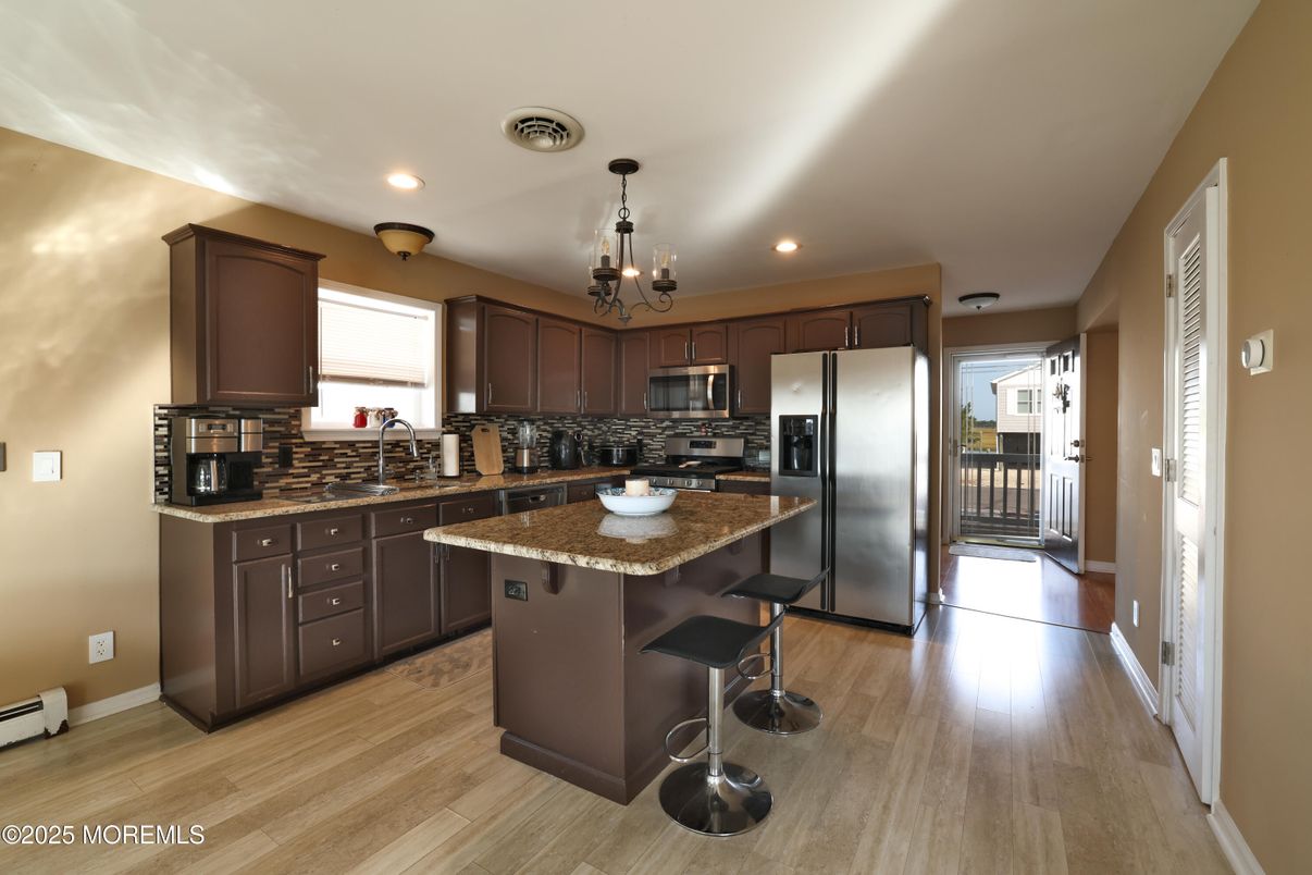 Chandelier, Interior, Kitchen, Pendant Lights, Recessed Lighting, Stainless Steel Appliances, Wood Texture Flooring