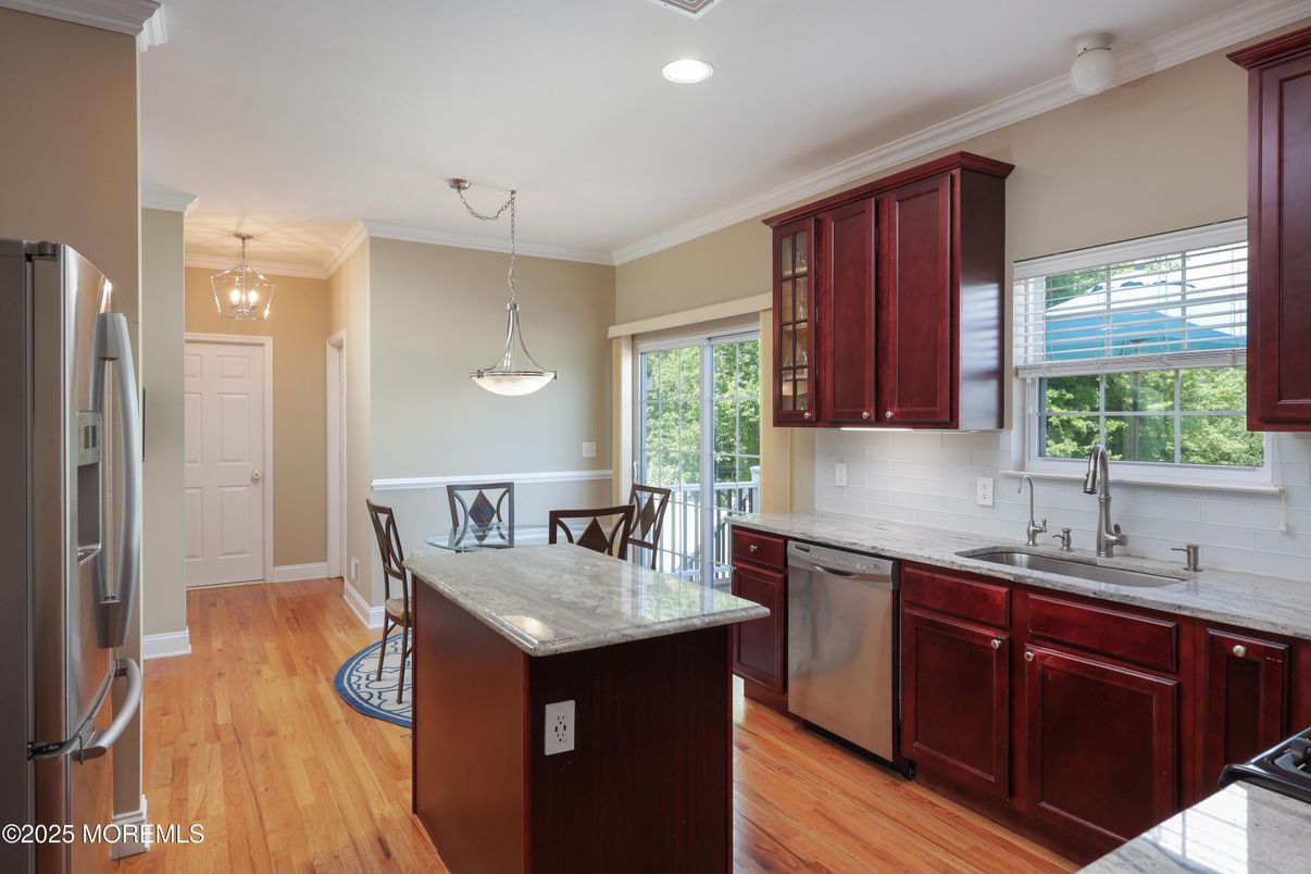 Dining room, Interior, Kitchen, Pendant Lights, Recessed Lighting, Stainless Steel Appliances, Wood Texture Flooring