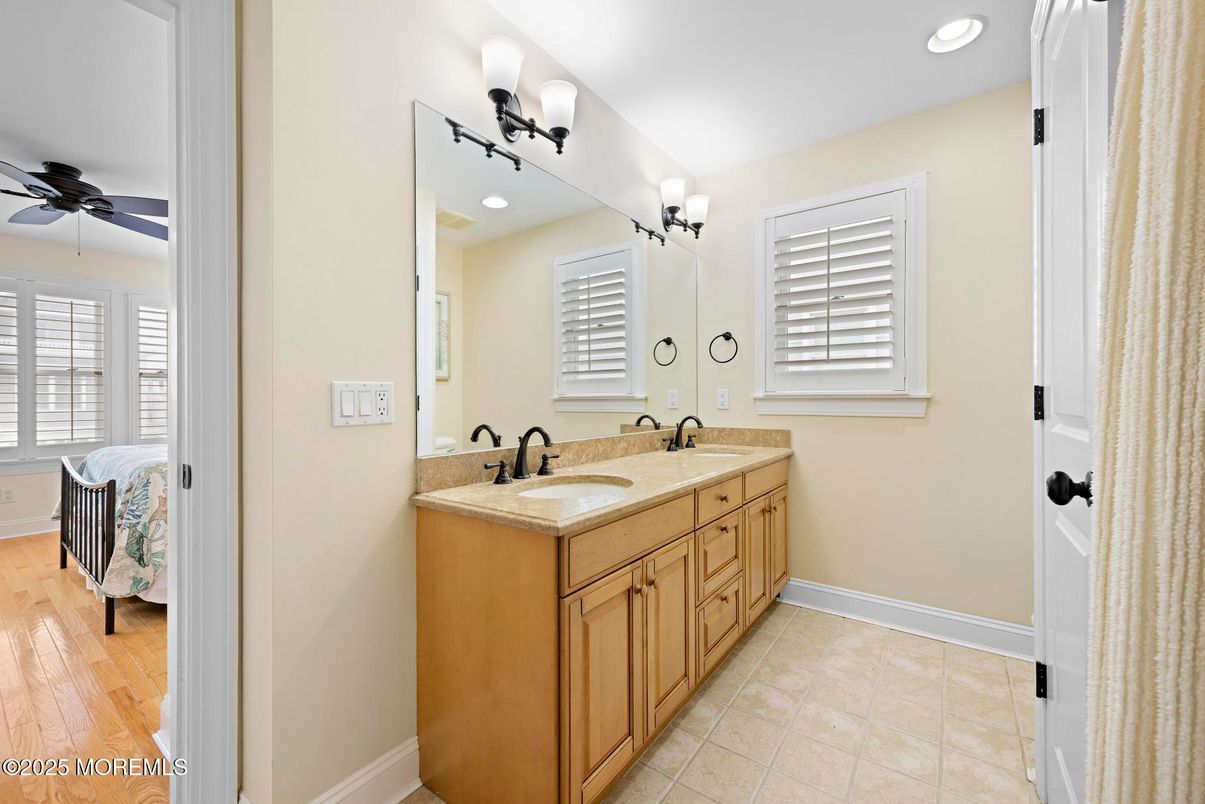 Bathroom, Dual Sink Vanities, Interior, Recessed Lighting, Wood Texture Flooring