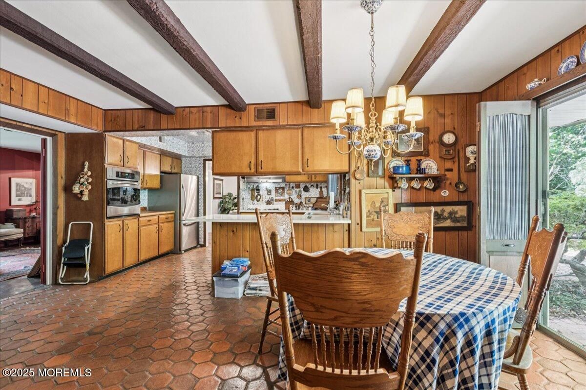 Chandelier, Dining room, Interior, Kitchen, Stainless Steel Appliances, Wooden Beams, Wooden Walls