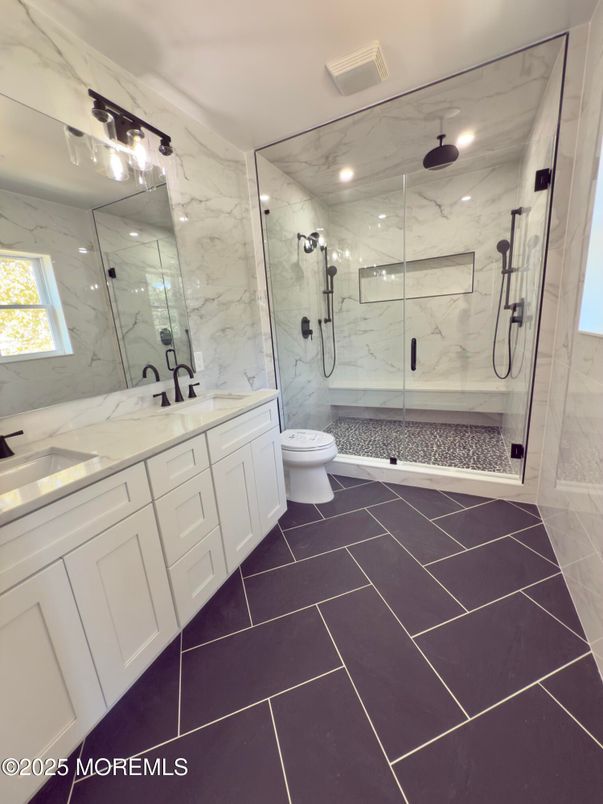 Bathroom, Dual Sink Vanities, Glass Shower, Interior, Marble Walls, Recessed Lighting