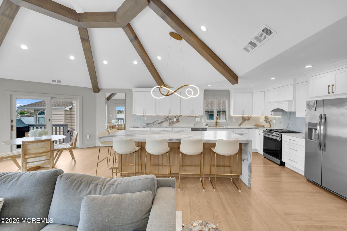 Dining room, Interior, Kitchen, Pendant Lights, Recessed Lighting, Stainless Steel Appliances, Wooden Beams, Wood Texture Flooring