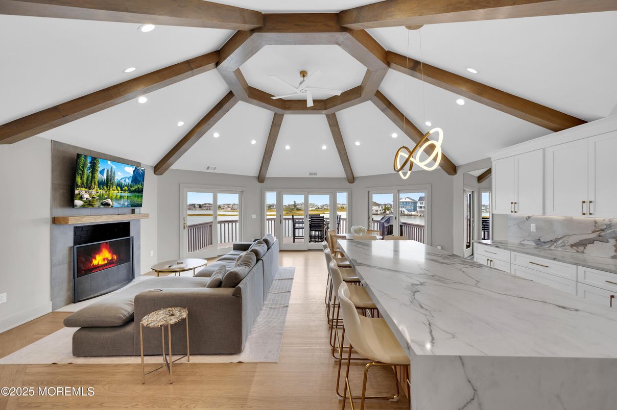 Fireplace, Interior, Living room, Pendant Lights, Recessed Lighting, Wooden Beams, Wood Texture Flooring