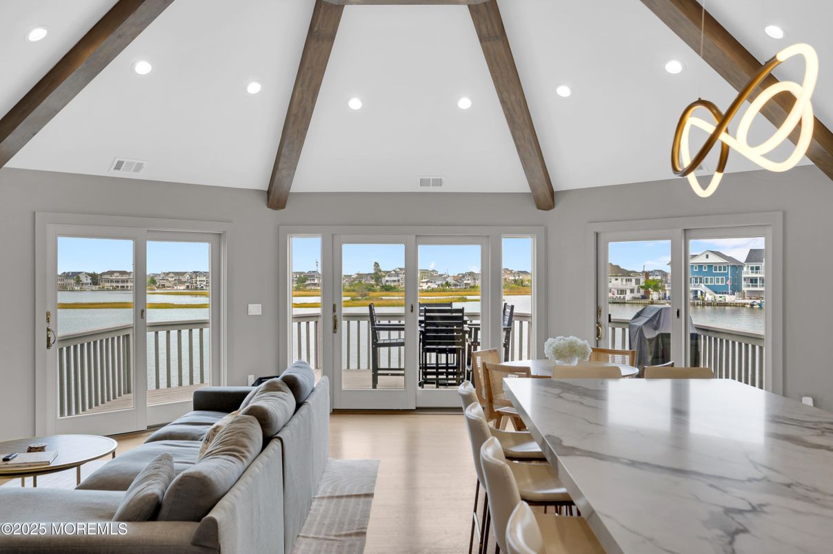 Dining room, Interior, Living room, Pendant Lights, Recessed Lighting, Water, Wooden Beams, Wood Texture Flooring
