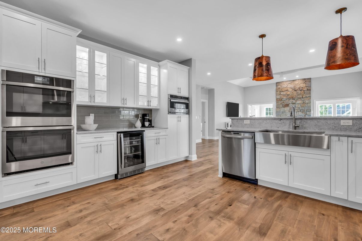 Interior, Kitchen, Pendant Lights, Recessed Lighting, Stainless Steel Appliances, Stone Walls, Wood Texture Flooring