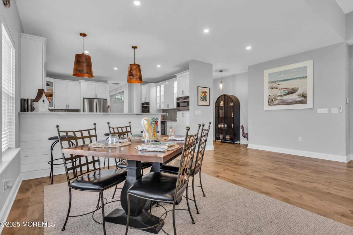 Dining room, Interior, Kitchen, Pendant Lights, Recessed Lighting, Stainless Steel Appliances, Wood Texture Flooring