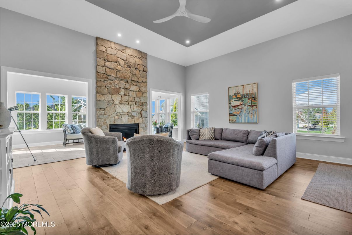 Fireplace, Interior, Living room, Recessed Lighting, Stone Walls, Wood Texture Flooring
