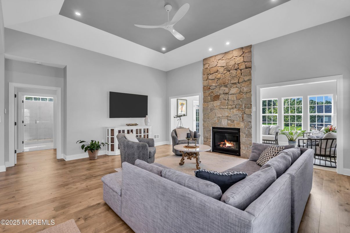 Fireplace, Interior, Living room, Recessed Lighting, Stone Walls, Wood Texture Flooring