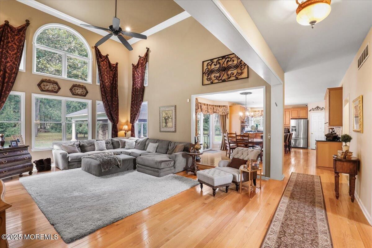 Chandelier, Dining room, Interior, Kitchen, Living room, Stainless Steel Appliances, Wood Texture Flooring