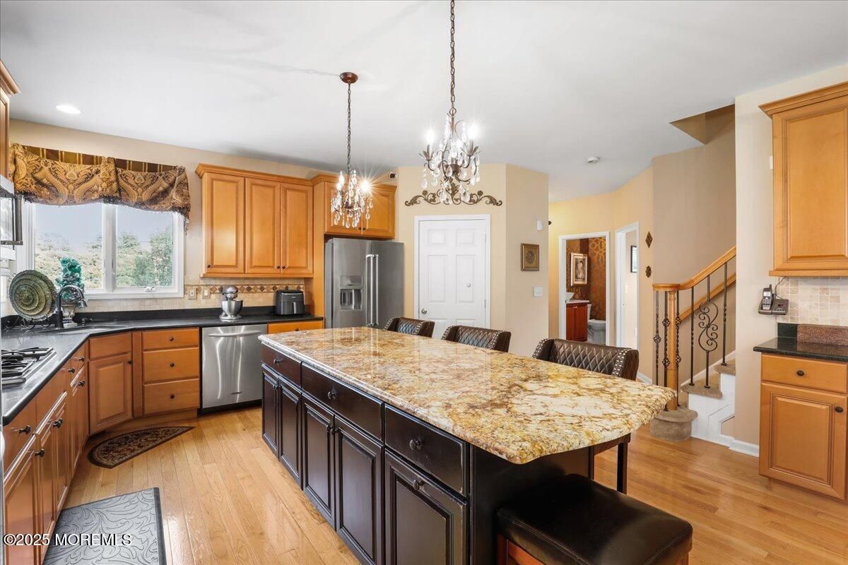 Chandelier, Interior, Kitchen, Pendant Lights, Recessed Lighting, Stainless Steel Appliances, Wood Texture Flooring