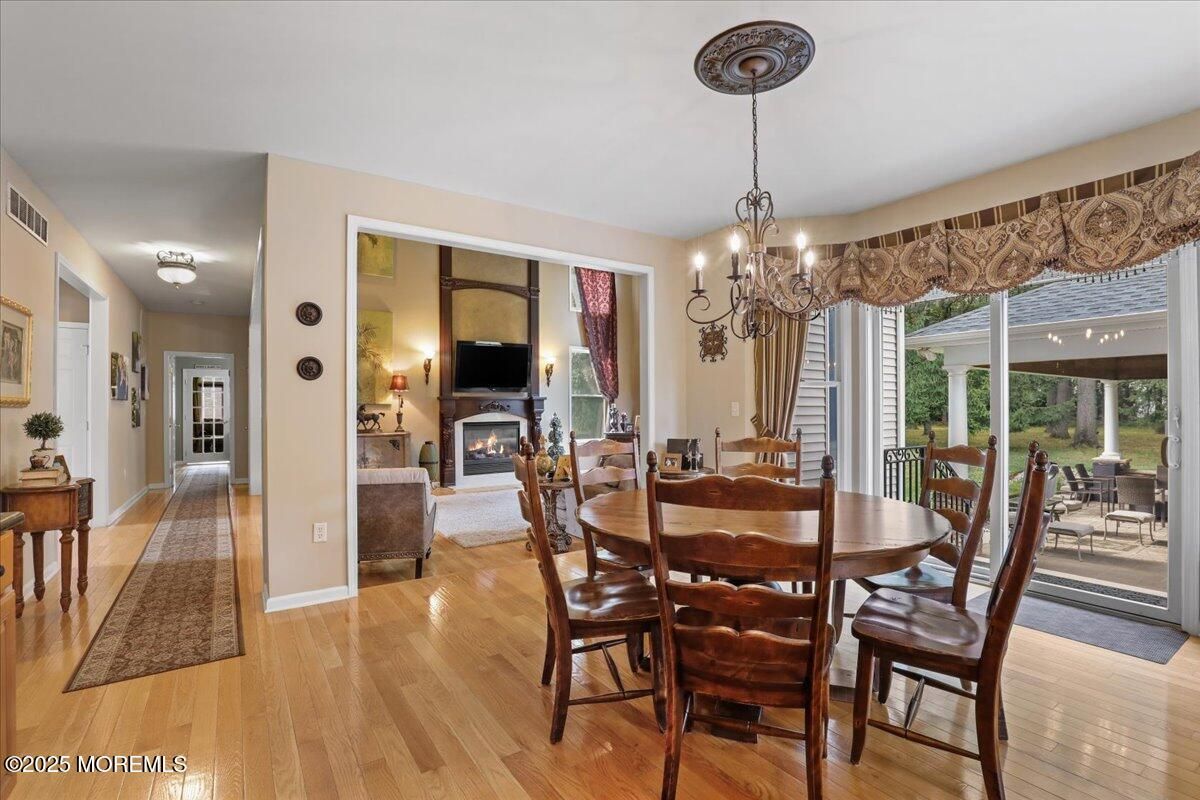 Chandelier, Dining room, Fireplace, Interior, Wood Texture Flooring