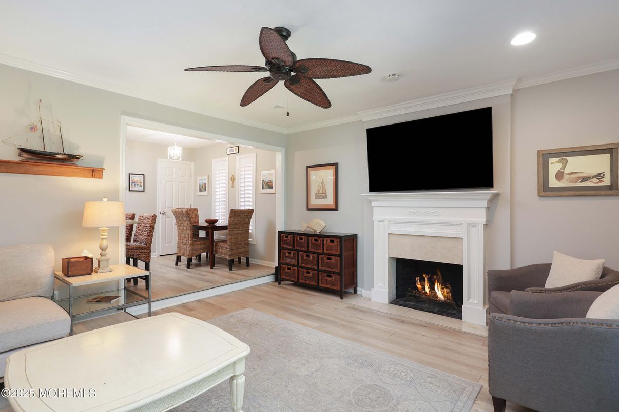 Dining room, Fireplace, Interior, Living room, Pendant Lights, Recessed Lighting, Wood Texture Flooring