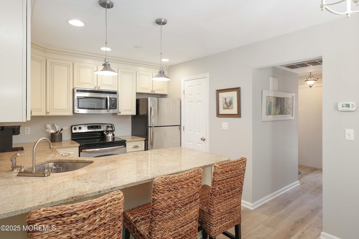 Interior, Kitchen, Pendant Lights, Recessed Lighting, Stainless Steel Appliances, Wood Texture Flooring