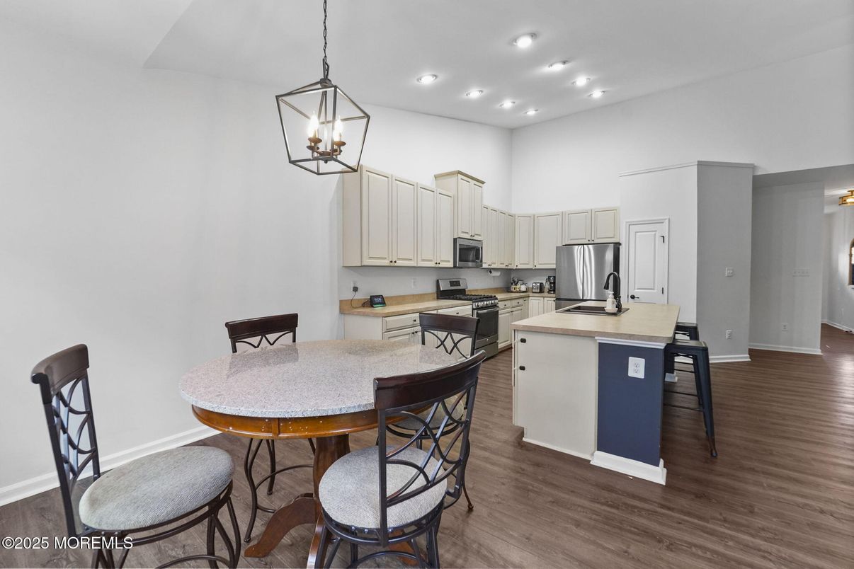 Dining room, Interior, Kitchen, Pendant Lights, Recessed Lighting, Stainless Steel Appliances, Wood Texture Flooring