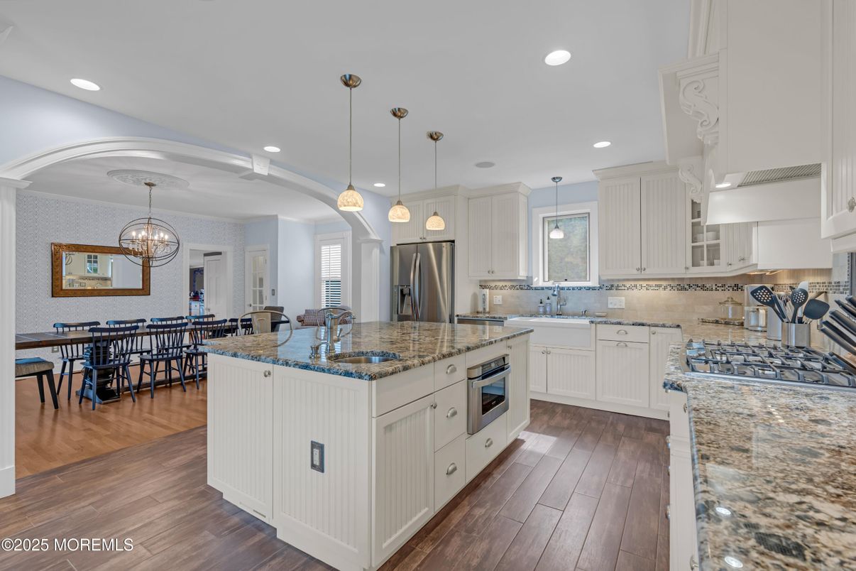 Chandelier, Dining room, Interior, Kitchen, Pendant Lights, Recessed Lighting, Stainless Steel Appliances, Wood Texture Flooring