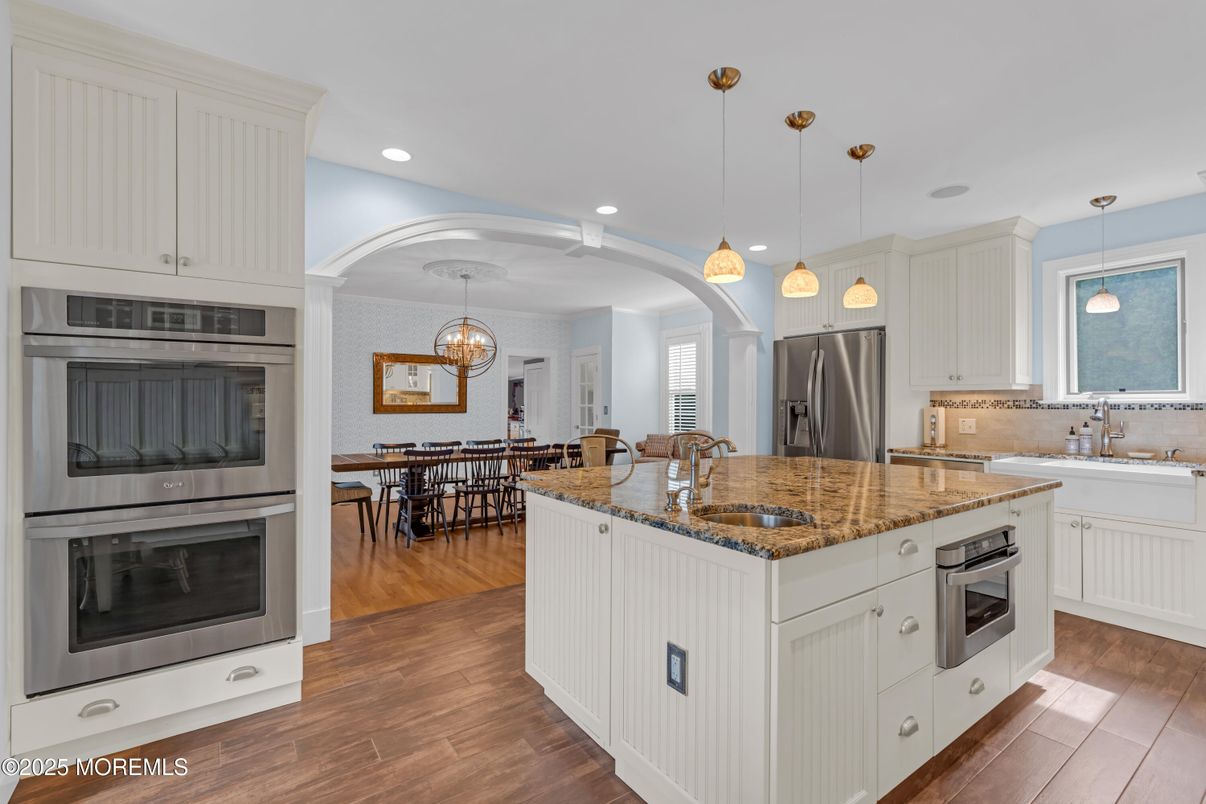 Chandelier, Dining room, Interior, Kitchen, Pendant Lights, Recessed Lighting, Stainless Steel Appliances, Wood Texture Flooring