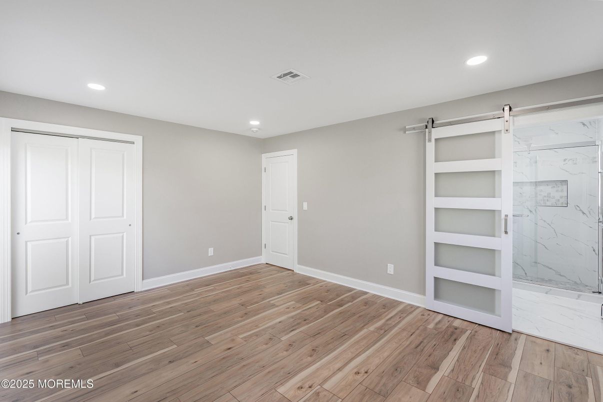 Bathroom, Empty room, Glass Shower, Interior, Marble, Marble Walls, Recessed Lighting, Wood Texture Flooring